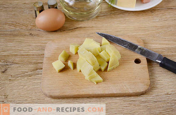 Boiled potatoes with an egg in a pan - a nourishing dish of 