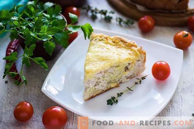 Open pie with chicken and potatoes under cheese crust