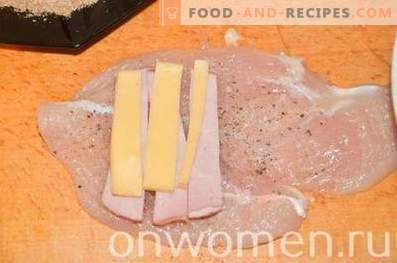 Chicken rolls with ham and cheese in a pan