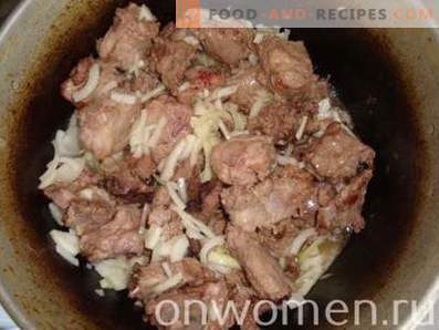 Pilaf of pork ribs in a cauldron