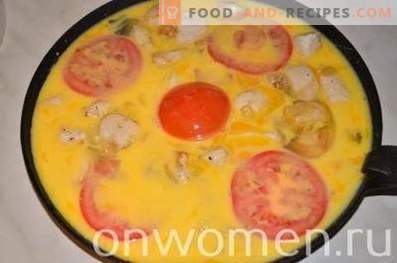 Omelet with chicken and tomatoes in the oven