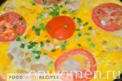 Omelet with chicken and tomatoes in the oven