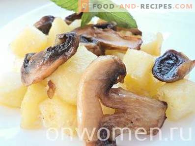 Potato fried with mushrooms in a pan