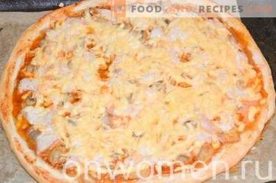 Pizza with chicken and mushrooms on yeast dough