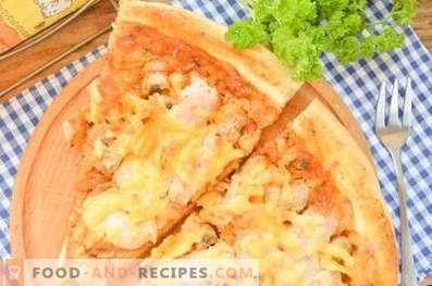 Pizza with chicken and mushrooms on yeast dough