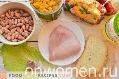 Salad with beans, crackers, corn and chicken