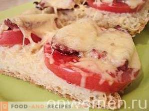 Hot sandwiches with tomatoes and hunting sausages
