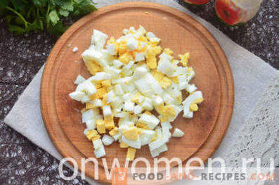 Salad with smoked chicken, pineapple, cheese, egg